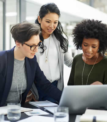 women collaborating at desk