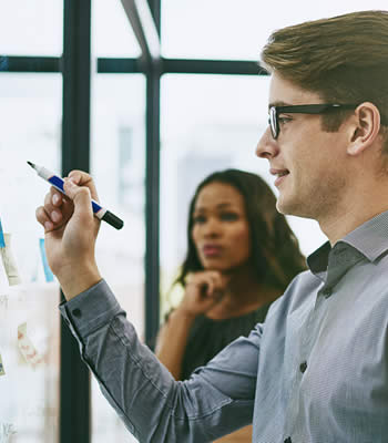 group of people at whiteboard