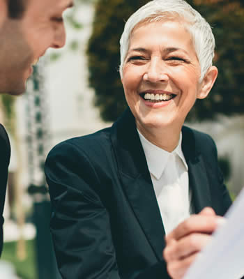 man and woman discussing paperwork