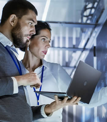 man and women in computer server room